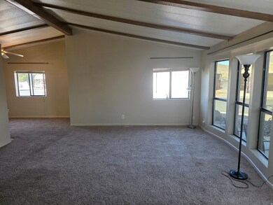 Unfurnished room with carpet floors and baseboards