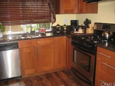 UPGRADED KITCHEN WITH GRANITE COUNTERS AND STAINLE