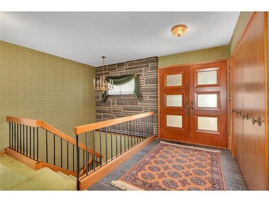 Spacious foyer with double closets and slate tiled