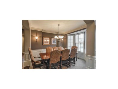 Dining room w sconce lighting off foyer and attach