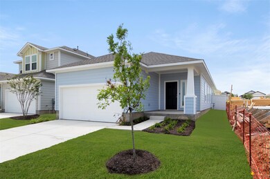 View of front facade featuring driveway, an attac
