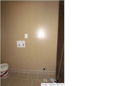 New main level Laundry Room with tile floor