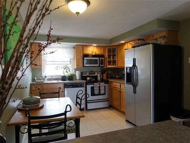 The kitchen offers tiled flooring...