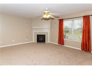 Family Room. The large, open Family Room boasts a gas fireplace and surround sound speakers.