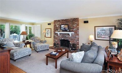 Living room offers a FP with custom mantle, crown 