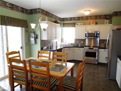 Eat-in kitchen with access to patio!