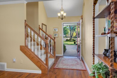 Entryway with ornamental molding, vaulted ceiling,