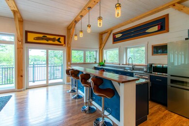 Open floor plan, balcony with water view