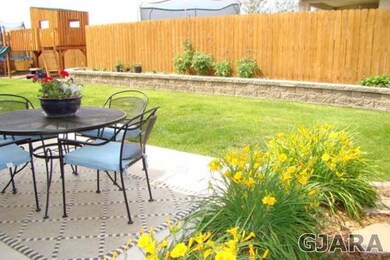 Beautifully landscaped backyard with mature landsc