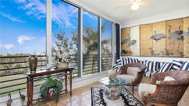 Sunroom featuring ceiling fan