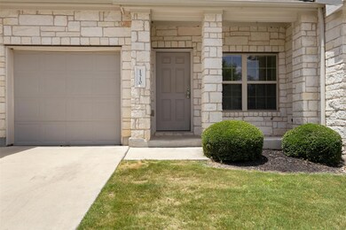 Entrance to property with concrete driveway and s