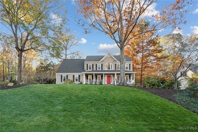 View of front of house with a front lawn and a porch