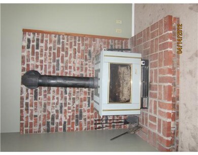 Living Room. Cozy up to the woodburning stove on a cool evening!