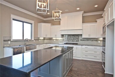 Double ovens, walk-in pantry, and gas five burner