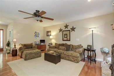 Open/large family room with hardwood flooring, cei