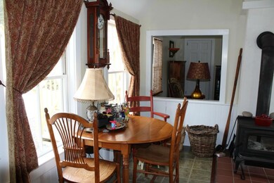 Eat in kitchen with woodstove hookup.