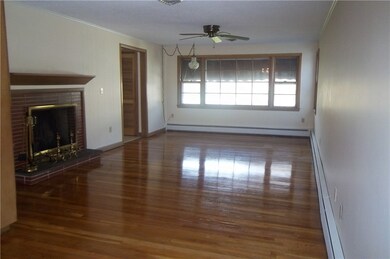 Living room with dining area on the back end, glea