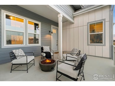 Covered front porch is large enough for an outdoor kitchen, a cozy firepit area or just snuggling up and taking in the incredible Colorado sunsets