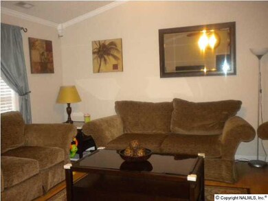 family room with large furniture, easy to place furniture in this home with valted celings, crown molding plantation blinds through out home,