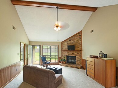 The greatroom also features a brick fireplace with
