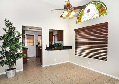 open dining area with open bar to kitchen