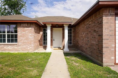 Property entrance with a yard