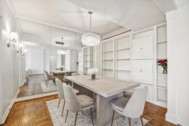 Mirrored wall adds elegance and depth to the dinin