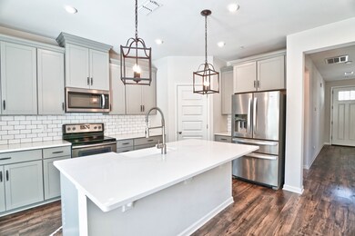 Quartz counters & tile backsplash