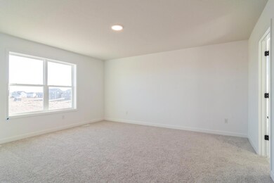 (*Photo of similar home, actual homes colors and finishes will vary) The large primary suite has lots of natural light!