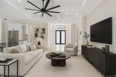 Living room featuring ceiling fan, visible vents,