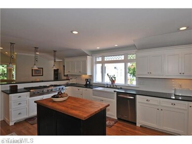 Kitchen. Custom island topped with reclaimed antique maple block