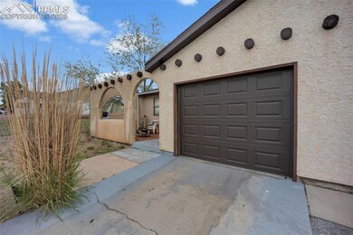 Garage featuring concrete driveway