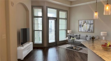 Living room with dark wood-type flooring