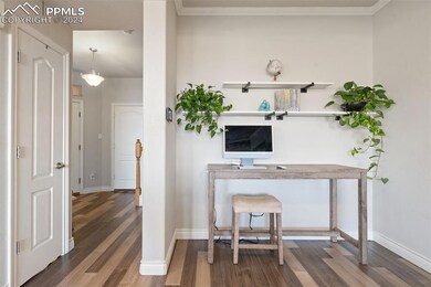 Office space featuring dark wood-type flooring and