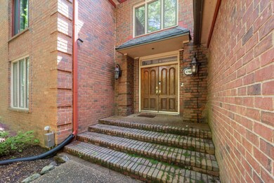 View of exterior entry with brick siding