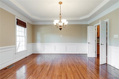 The formal dining room features shadowbox detailin