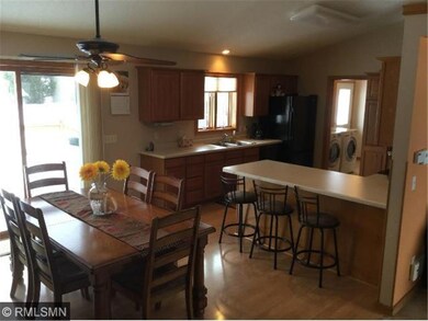 View of kitchen and dining room.  Patio off dining