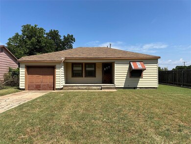 View of front facade featuring a garage and a fron