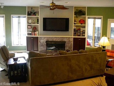 Den/Family/Great Room. View from the entry foyer of the Great Room with windows overlooking the lake.