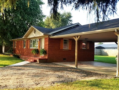 All Brick Home with attached  2 Car Carport.