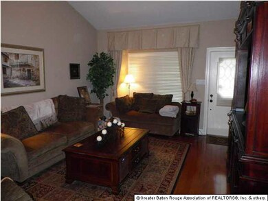Another view of Living room with a nice bank of wi
