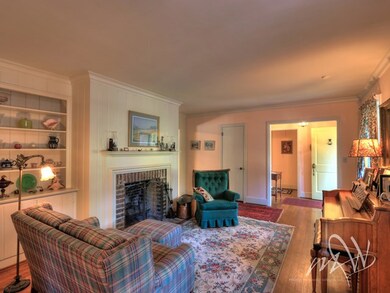 Living room with brick around fireplace