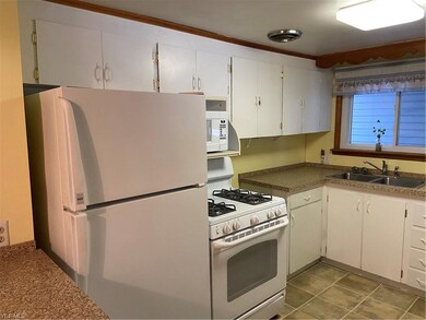 Kitchen with appliances included.