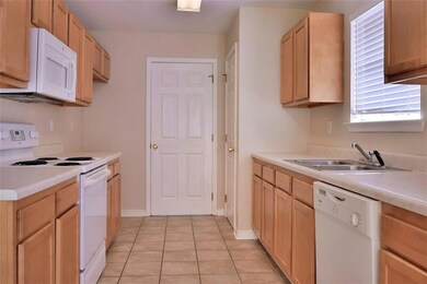 Kitchen Area.  Laundry Room behind door.