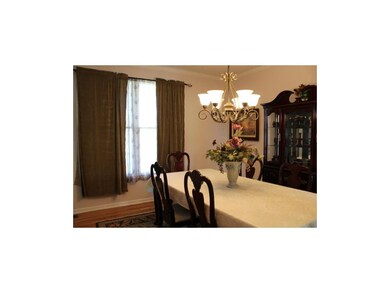Formal dining with hardwood floors.