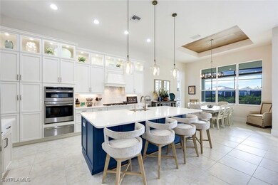 Kitchen featuring a kitchen bar, premium range hoo
