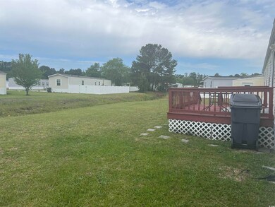 View of yard with a wooden deck