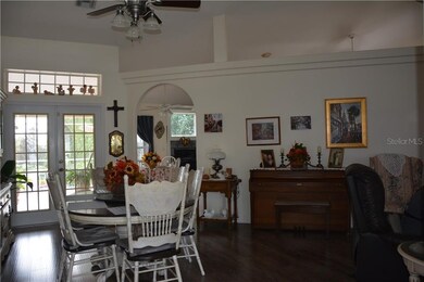FORMAL DINING ROOM, FRENCH DOORS AND LARGE PLANT S