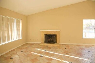 The Living Room w/ Fireplace.