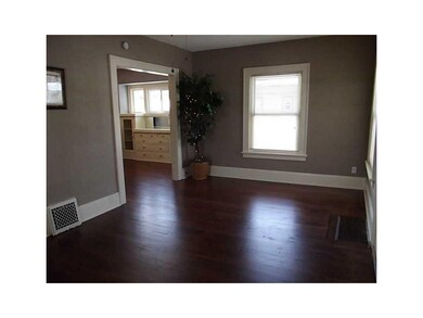 Family Room-L1. Dark stain warms the gleaming hard